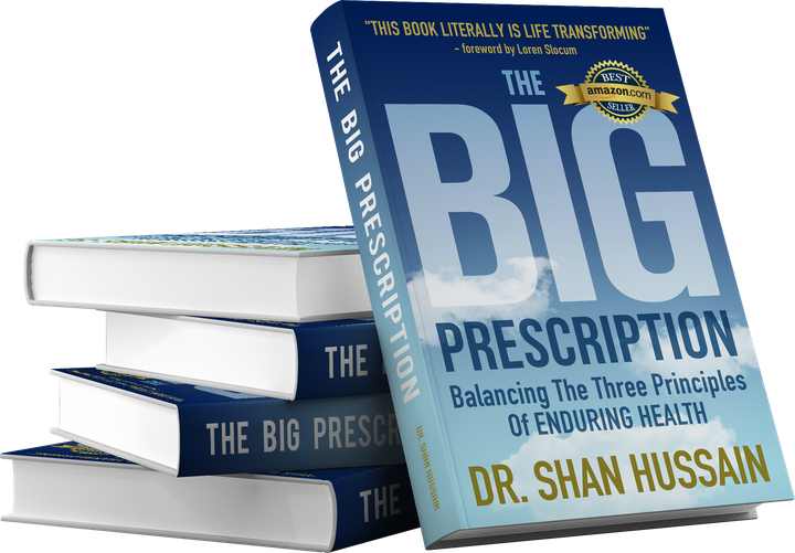 A stack of hardback copies of The Big Prescription beside a single copy standing upright
